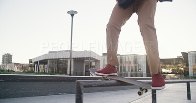 Buy stock photo Skateboard, legs and balance on rail at skatepark for grind stunt, training performance or workout. Skater, person and talent in city with skating challenge, hobby and practice action trick outdoor