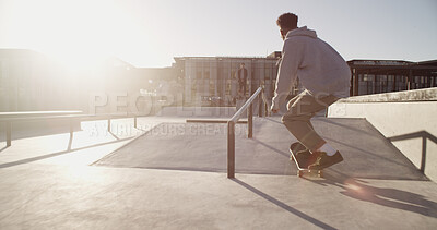 Buy stock photo Man, skateboard and ramp in city, talent and fitness with freestyle practice, sports and balance. Person, skater and challenge with stunt, outdoor and workout with competition, training or lens flare