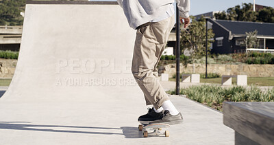 Buy stock photo Skateboard, ramp and legs with skating at skatepark for stunt, performance challenge and training. Skater, person and extreme sport in city for adventure, hobby and practice technique with balance
