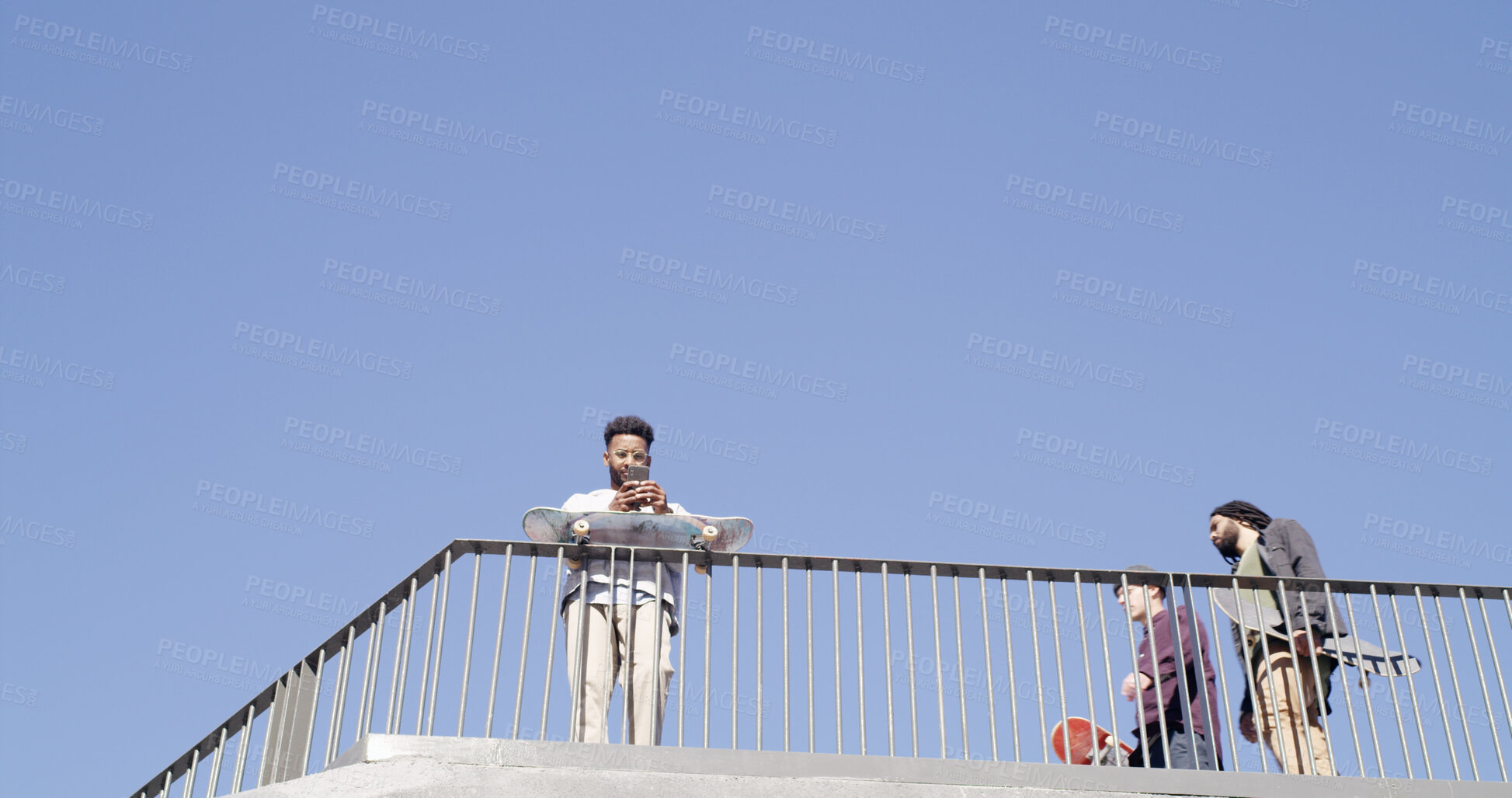 Buy stock photo Phone, streaming and search with man at skate park for social media, communication and online tutorial. Stunt tips, connection and space with low angle of person and skateboard for hipster and mockup
