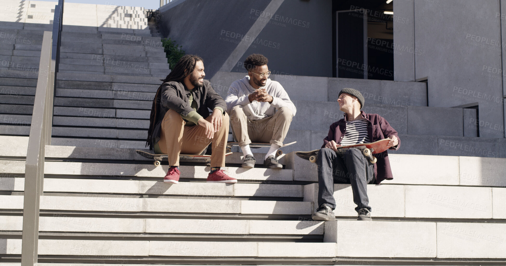 Buy stock photo Skaters, friends and relax with men in city for conversation, chat or story on steps. Skateboard, sports and outdoor together for hobby, hangout and group on stairs with streetwear for fashion