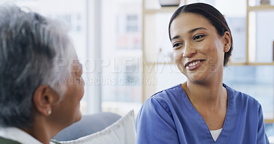 Buy stock photo Talking, nurse and smile with old woman on sofa for support, occupational therapist and medical. Healthcare advice, discussion and senior patient with caregiver in nursing home for consulting