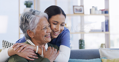Buy stock photo Senior woman, nurse and hug on sofa for healthcare support, medical service and bonding. Happy, elderly patient and caregiver with embrace in home for health treatment success, good news and kindness