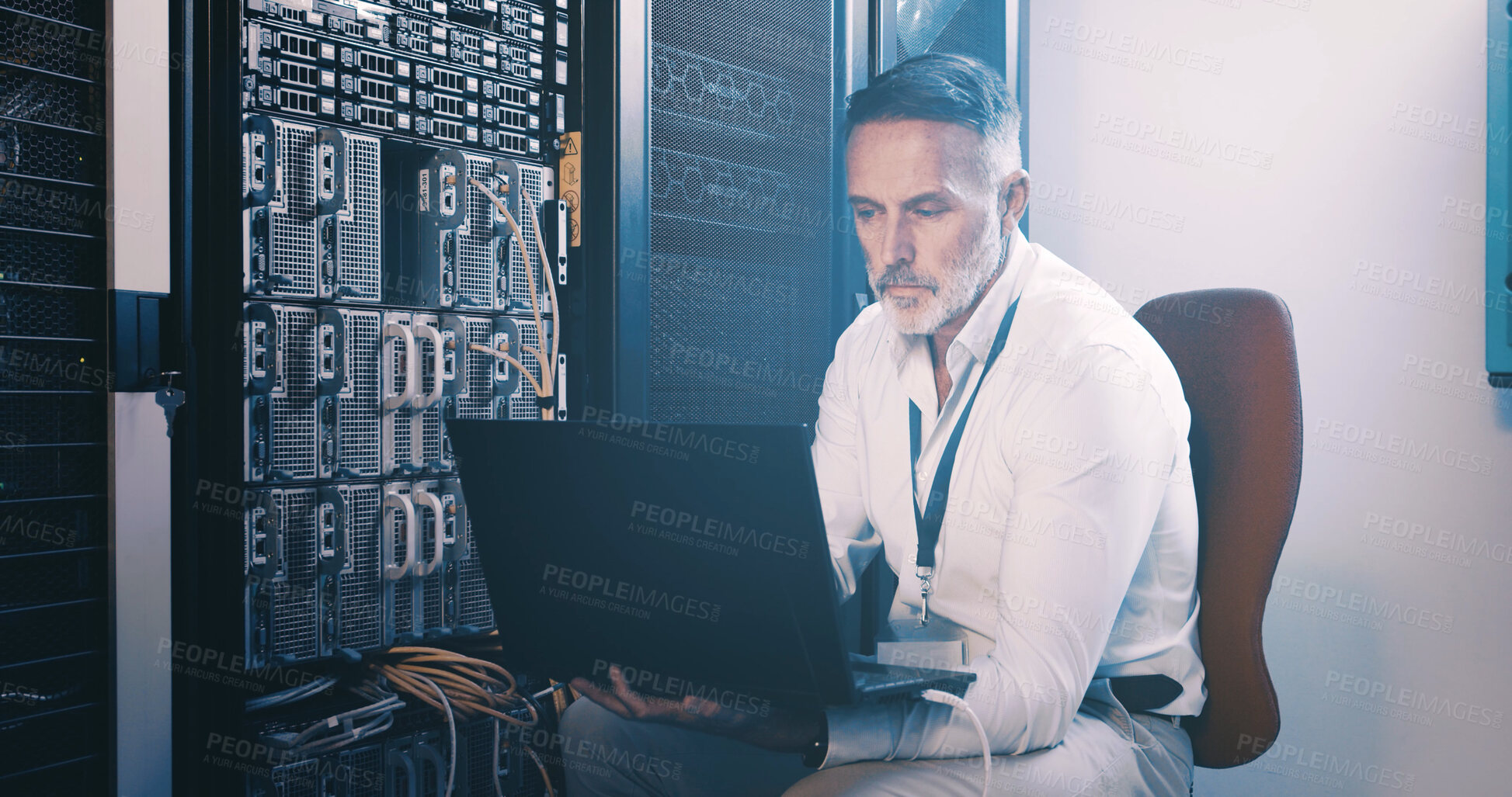 Buy stock photo Server room, programmer and man with laptop, online reading and hardware problem solving. IT specialist, cyber security or mature person in workplace, pc and tech upgrade with inspection and coding