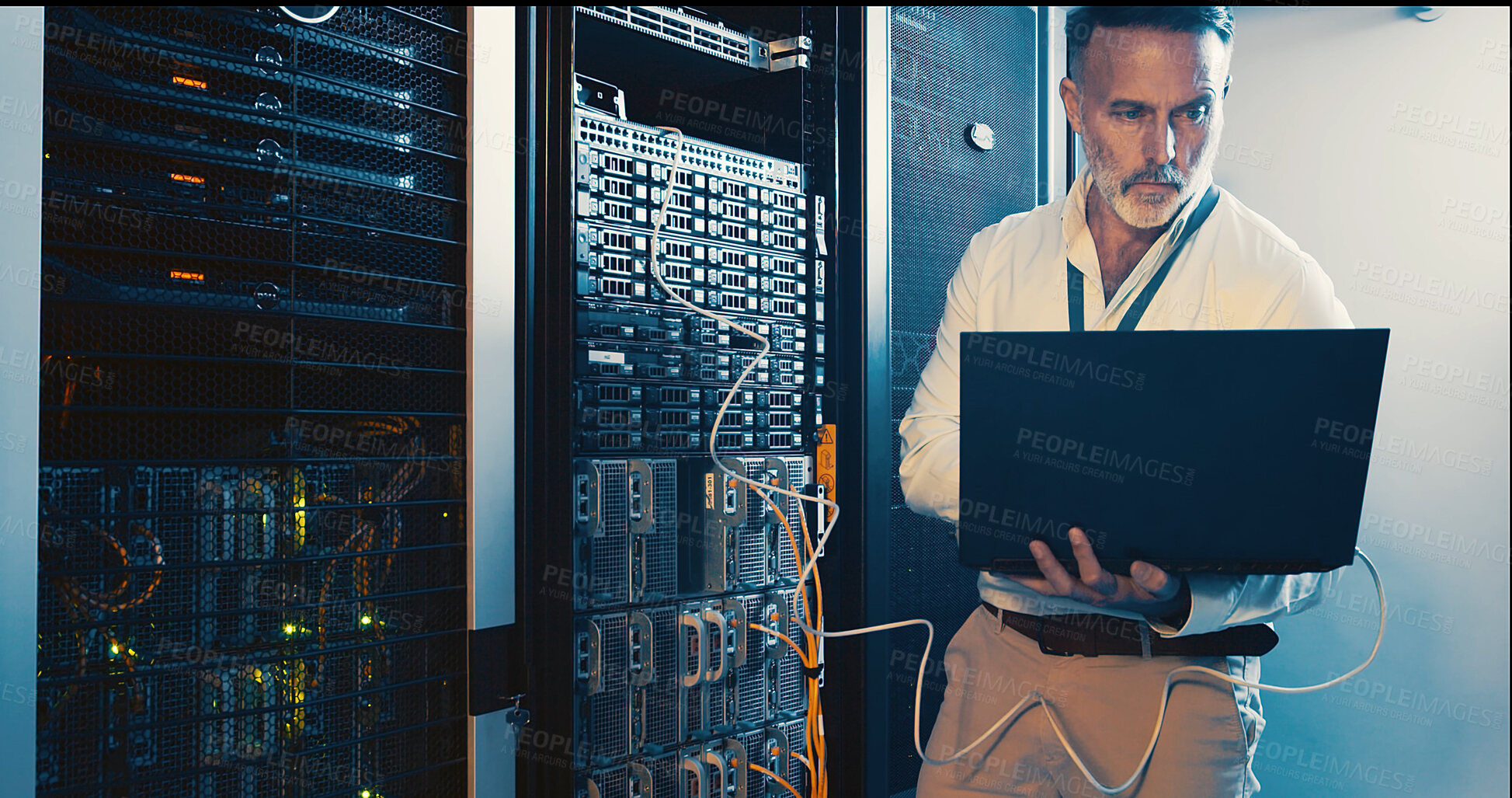 Buy stock photo Server room, programmer and man with laptop, tech upgrade and hardware problem solving. IT specialist, mature person and employee in workplace, pc and cyber security with solution and engineering