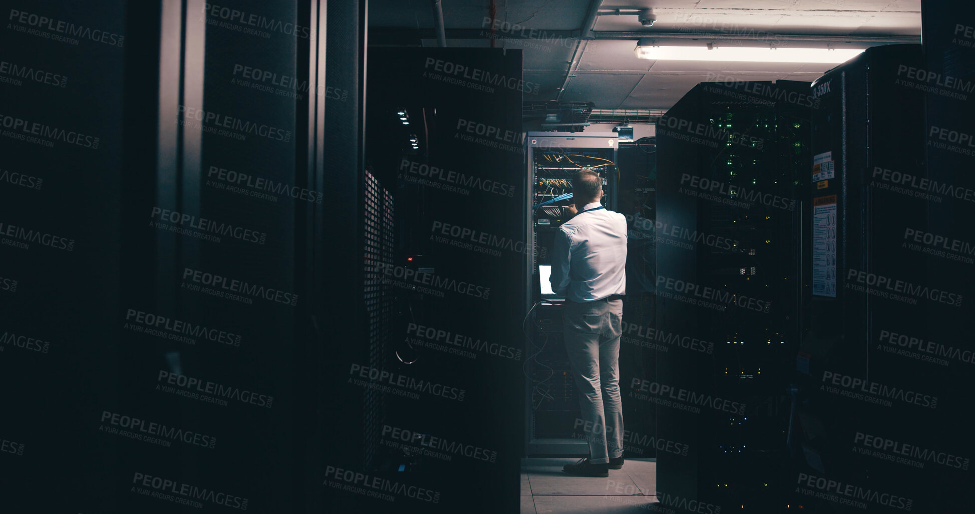 Buy stock photo Technician, back and inspection with man in server room for cybersecurity, network and system database. Software update, signal transmission and cloud computing with person in data center for upgrade