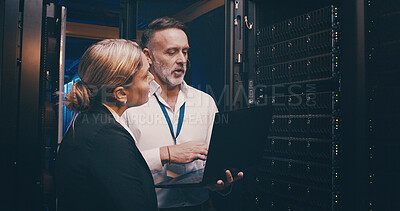 Buy stock photo Server room, talking and people on laptop for technical support, network maintenance and database. IT technicians, team and man with woman on computer for diagnostics, system update and cybersecurity