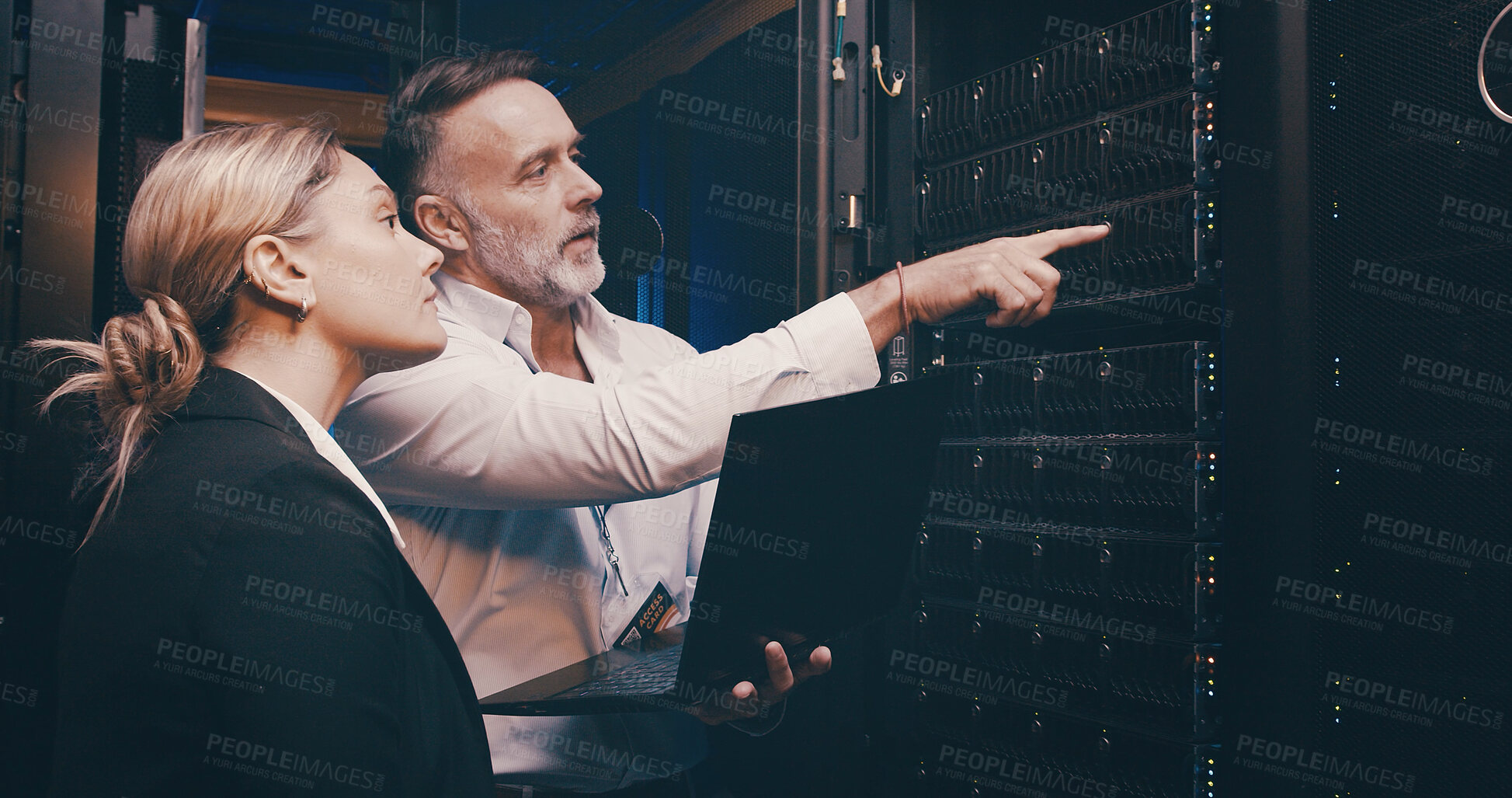 Buy stock photo Laptop, pointing and team of engineers in control room for technical support, database or cybersecurity. Computer, collaboration and people with system upgrade in data center for network programming.