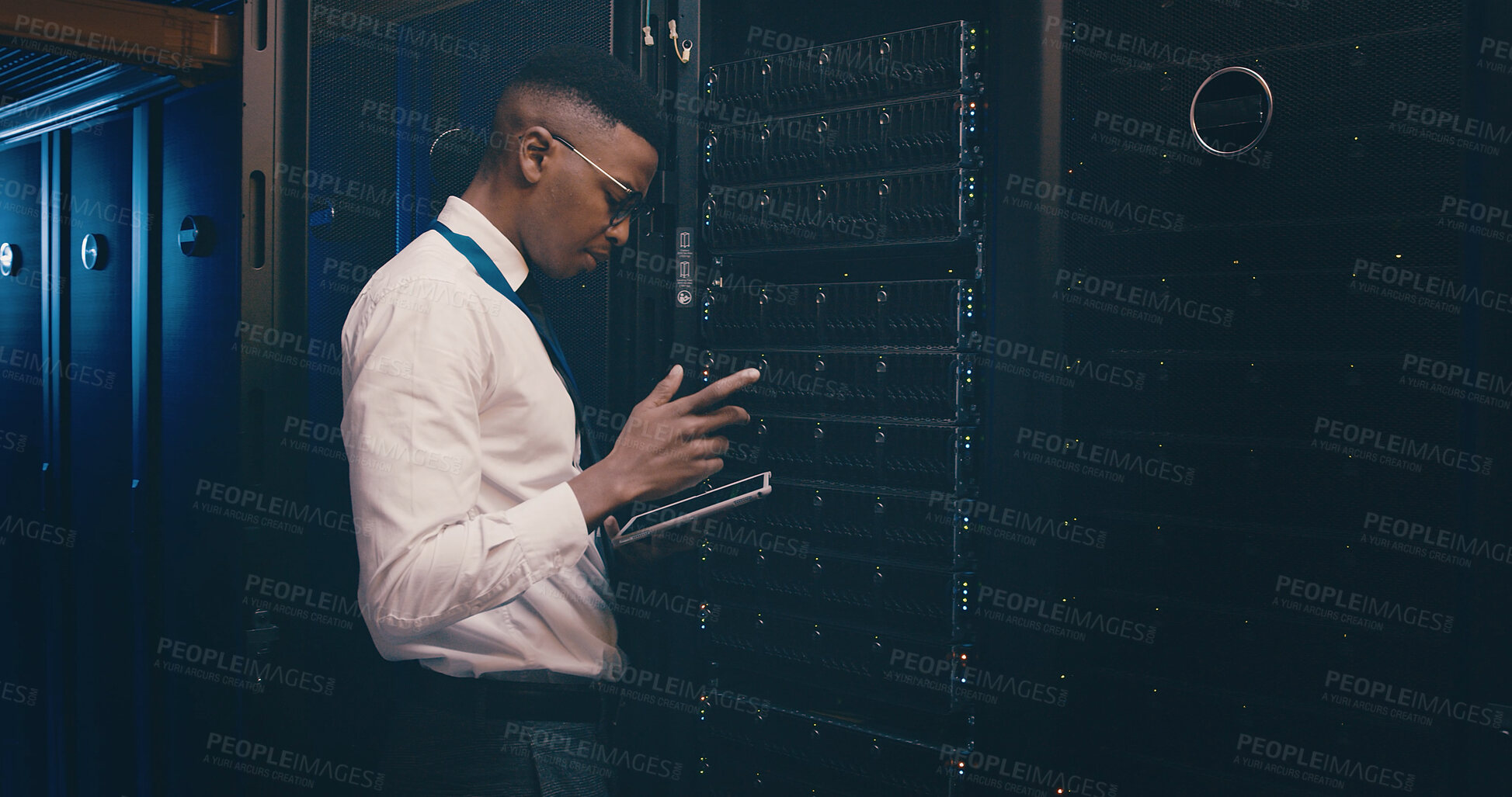 Buy stock photo Engineer, black man and reading tablet in server room for cybersecurity, database update and GDPR. Data center, serious person or digital app for network configuration, problem solving or maintenance