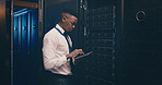 Technician, black man or typing on tablet in server room for system maintenance, update or GDPR. Data center space, person or tech for troubleshooting software, problem solving or network performance
