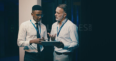 Buy stock photo Talking, online and men in server room on tablet for network solution, IT support and cybersecurity. Meeting, space and people on digital tech for database, programming maintenance or hardware update