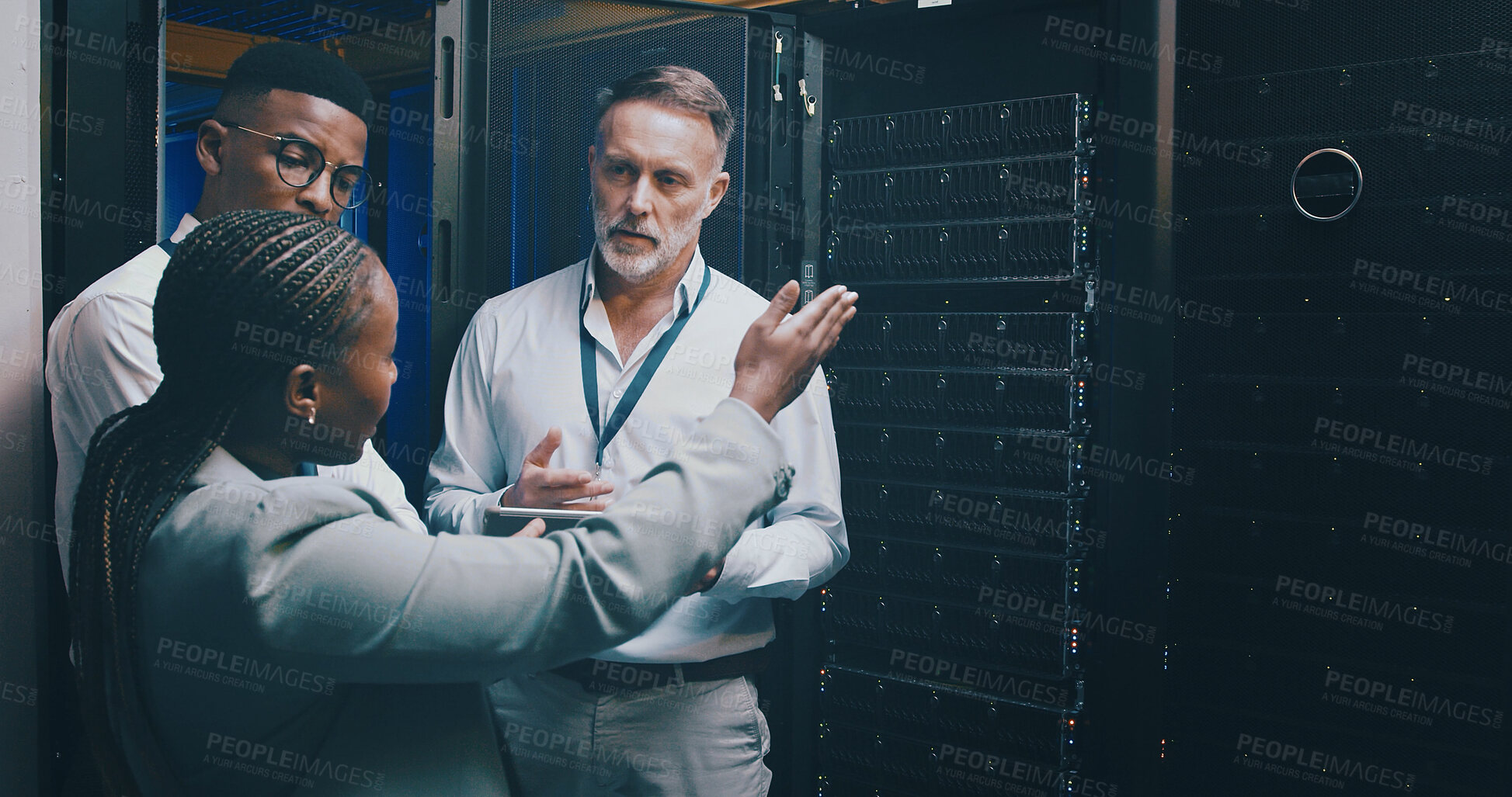 Buy stock photo Collaboration, conversation and tablet with people in server room for network administration. Communication, cybersecurity and tech support with team in data center for maintenance of mainframe