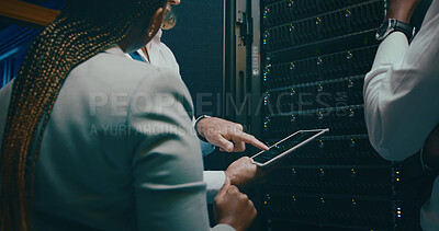 Buy stock photo Tablet screen, hand and discussion in server room for maintenance, code or system performance. Tech, engineer and group of people in data center for network diagnostics, IT or pointing to analytics