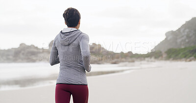 Buy stock photo Back of woman, fitness and run on beach for exercise, workout or outdoor wellness. Female person, athlete or runner with marathon, preparation and cardio training with space in nature for health