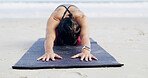 Woman, yoga and childs pose at beach in summer, mudra and zen mindfulness in morning at shore. Person, meditation and breathing on ground, nature and outdoor by ocean on vacation in New Zealand