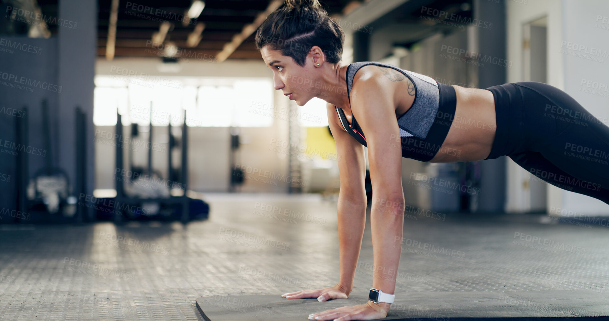 Buy stock photo Push up, fitness and workout with woman in gym for exercises, core strength and health. Bodybuilder, challenge and arm training with person on floor of sports club for athlete, muscle and wellness