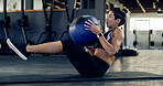 Exercise, medicine ball and fitness with woman in gym for abs workout, health and russian twist. Wellness, bodybuilder and core strength with person on floor of sports club for oblique training