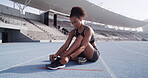 Fitness, track and woman tie shoes ready for race challenge, marathon training and exercise. Sports, athlete and person with sneakers for running, competition and cardio workout on outdoor arena
