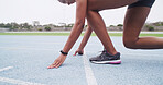 Feet, hands and launch of race with woman in stadium for challenge, competition or sports tournament. Exercise, fitness and start with running athlete at line in arena for event, performance or speed