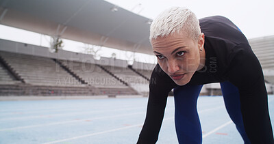 Buy stock photo Starting line, race track and woman athlete in stadium for running, practice or training for competition. Fitness, runner and person getting ready for cardio workout, exercise or challenge at space.