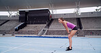 Athlete, woman and tired of track at stadium with breathing, running recovery or training endurance. Fitness, girl and exhausted with break for sports challenge, marathon burnout and exercise fatigue