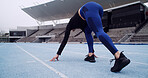 Starting line, track and back of woman in stadium for running, practice or training for competition. Fitness, runner and athlete getting ready for race, cardio workout or exercise at sports arena.