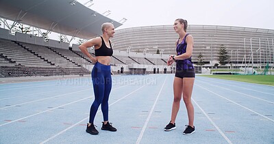 Buy stock photo Talk, athlete and women at stadium, break and workout routine with instructor and fitness for sport. Outdoor, personal trainer and people with smile for marathon, team and healthy with exercise
