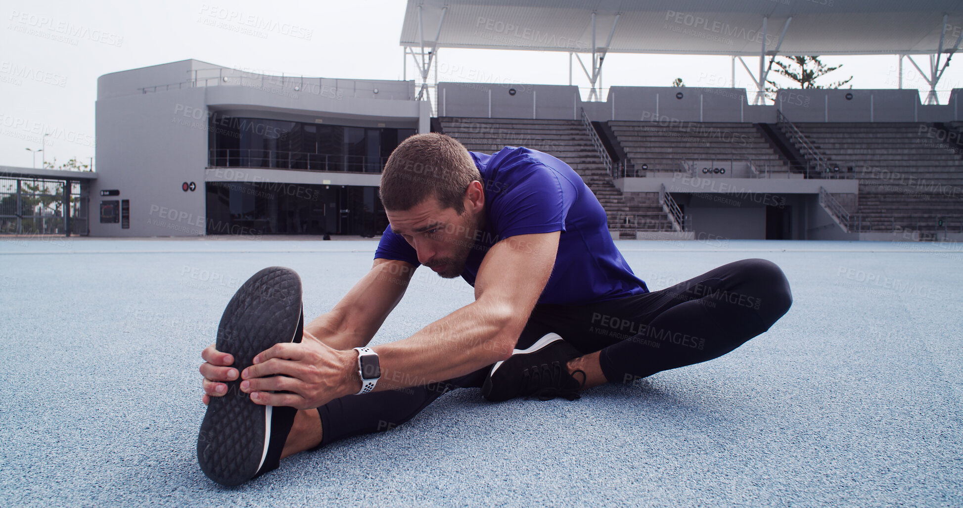 Buy stock photo Athlete, man and warm up at stadium for fitness, exercise and getting ready for marathon. Male person, relax and stretching muscles for training, runner workout and preparation of sports competition 