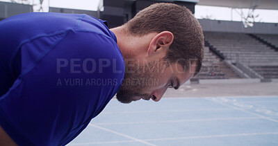 Buy stock photo Tired, runner and man on break at race track for exercise recovery, health and wellness outdoor. Stadium, exhausted athlete and rest for fitness, cardio challenge and fatigue for athletic sports
