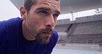 Athlete, man and tired with face at stadium for fatigue, race break or competition with burnout. Fitness, workout and runner training for marathon, endurance challenge or exhausted for recovery