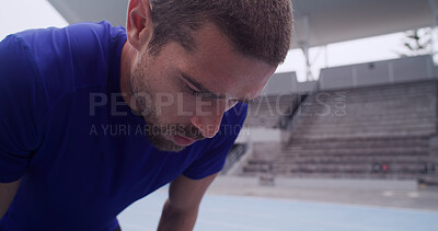 Buy stock photo Fitness, man and tired with breathe at stadium for fatigue, race break or competition with burnout. Athlete, workout and runner training for marathon, endurance challenge or exhausted for recovery