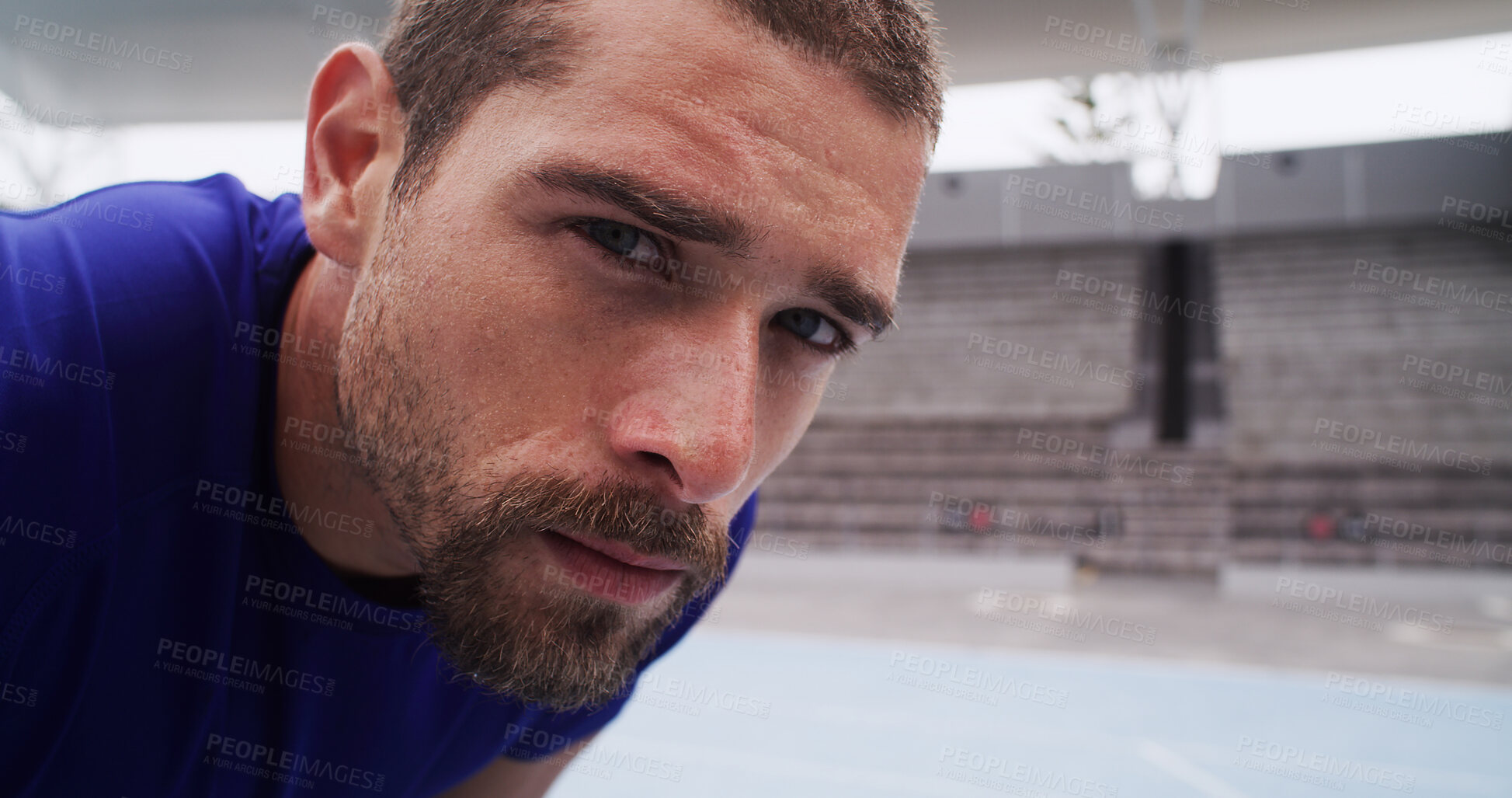 Buy stock photo Portrait, runner and man on break at race track for exercise recovery, health and serious face. Stadium, tired athlete and rest for fitness, cardio challenge or determination for sports with space