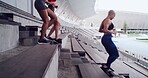 Group, woman and running on stairs at stadium for fitness, cardio exercise and marathon practice. Athlete, people and team training on steps for endurance, sports workout and tournament preparation