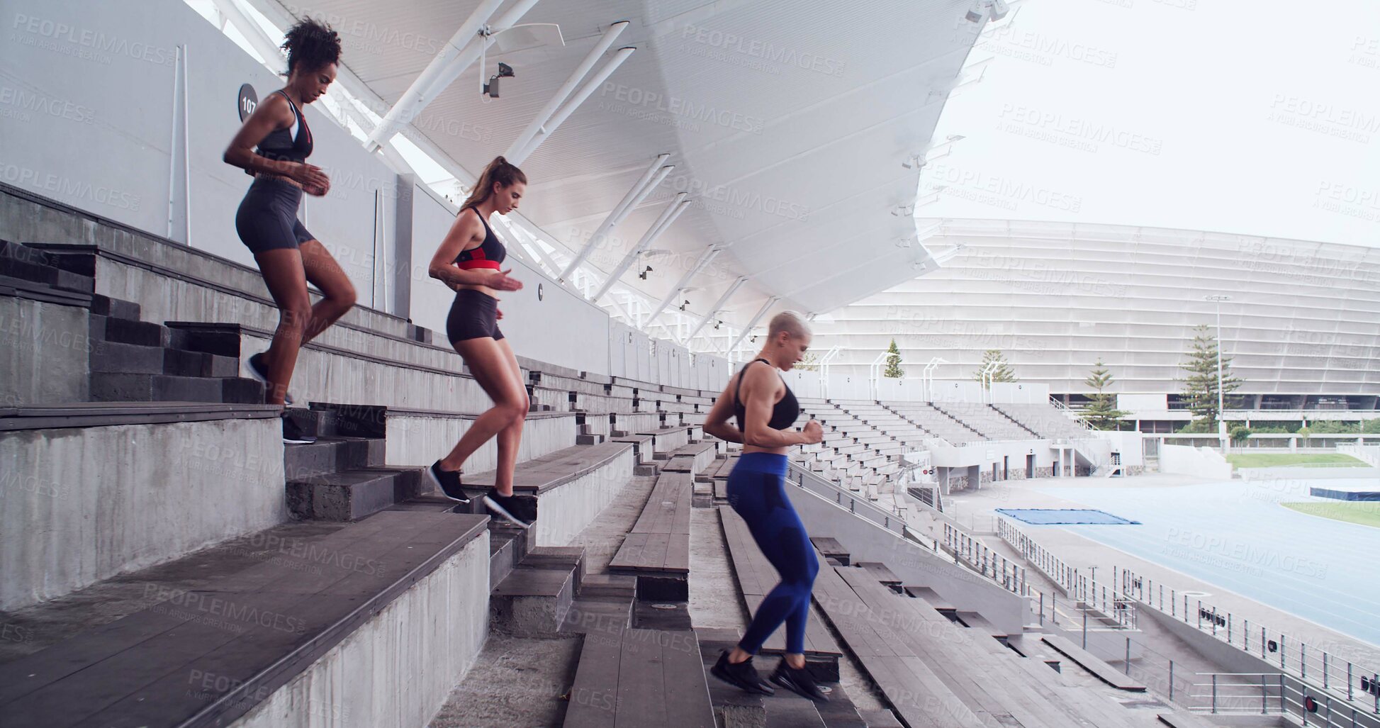 Buy stock photo Group, people and running on stairs at stadium for fitness, cardio exercise and marathon practice. Athlete, women and training on steps for endurance, sports workout and preparation for tournament