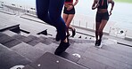 Above, people and running on stairs at stadium of fitness, cardio exercise and marathon practice. Athlete, women and training on steps for endurance routine, sports workout and challenge preparation
