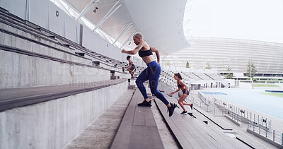Buy stock photo Athlete, woman and running on stairs at stadium for fitness, cardio exercise and marathon practice. People, performance and training on steps for endurance, sports workout and tournament preparation