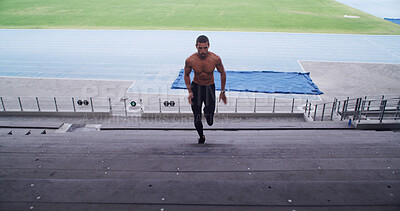 Buy stock photo Man, athlete and running with steps for fitness, performance training or practice at stadium. Active, male person or sprint with staircase, endurance or warm up for workout preparation for athletics