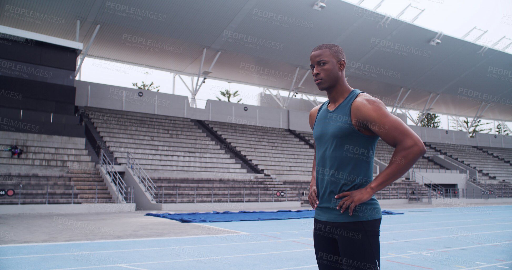 Buy stock photo Black man, athlete and portrait at stadium for training routine, challenge and ready on track. African person, runner and outdoor at arena for fitness, exercise and workout at sports club in Kenya
