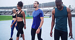 Runner, relax and fitness with people on race track for workout, cardio challenge and marathon practice. Competition, training and contest with friends in stadium for sports athlete and team
