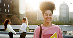 Girl, university student and happy at campus with books, pride and back to school in city. Woman, smile and outdoor in portrait with confidence for learning, scholarship and college education in town