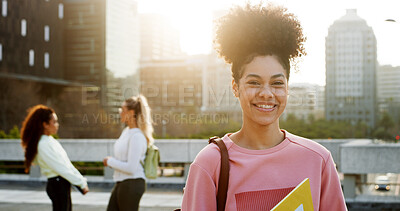 Buy stock photo Girl, university student and happy at campus with books, pride and back to school in city. Woman, smile and outdoor in portrait with confidence for learning, scholarship and college education in town