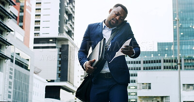 Buy stock photo Black man, phone call and walk in city with paperwork for overworked, late appointment or schedule. Busy, folder and business person on smartphone for communication, networking with stress or anxiety