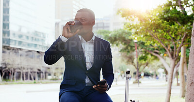 Buy stock photo Black man, drinking and coffee with suitcase in city for travel, waiting or delay at pick up. Businessman, thinking and commute with beverage, phone or luggage in town for lift or transportation