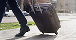 Feet, luggage and walking with businessman in city for commute, journey or travel to location. Destination, steps and suitcase with legs of employee outdoor on sidewalk for international trip