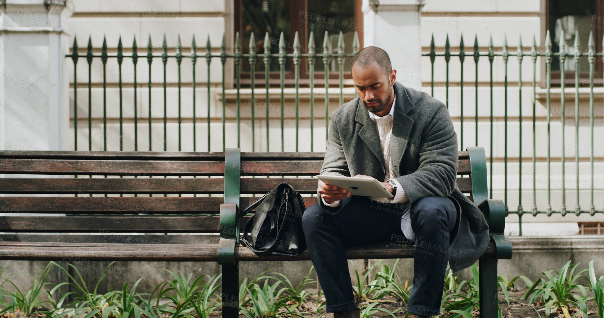Buy stock photo Tablet, outdoor and business man on bench for reading email, research or housing development. Tech, city and serious urban planner with app for online project or review proposal for infrastructure