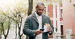 Business, man and phone with food for travel in city, browsing social media and lunch break. Male person, reading and mobile with healthy meal, direction search and notification update for urban trip