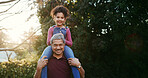 Grandfather, shoulder carry and kid in park for fun together, bonding and summer vacation portrait. Happiness, old man and girl with piggyback, playful or game with love for memory and adventure