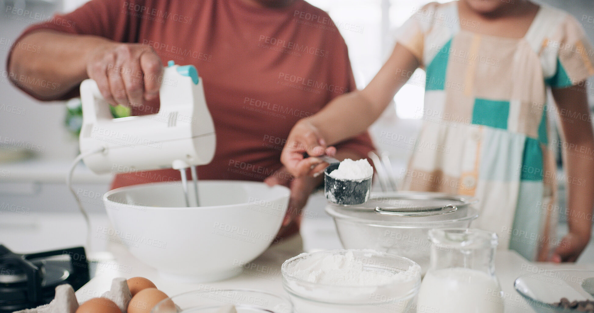 Buy stock photo Hands, mixing and baking with child, kitchen or parent with ingredients, skill development and home. Teaching, kid and person with bowl for pastry, helping and learning recipe for meal prep in house