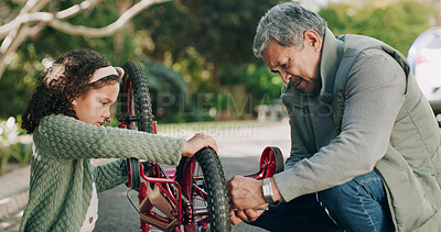 Buy stock photo Repair, grandfather or child with bicycle outdoor for fixing wheel, ride safety or bonding together. Family, girl and help old man with tool in road for bike maintenance, rim problem or cycling hobby
