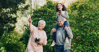 Buy stock photo Bird watching, grandparents and girl with family, outdoor and  bonding together with nature. Grandchild, old man and senior woman in forest, binocular and hobby with view, sightseeing and pointing